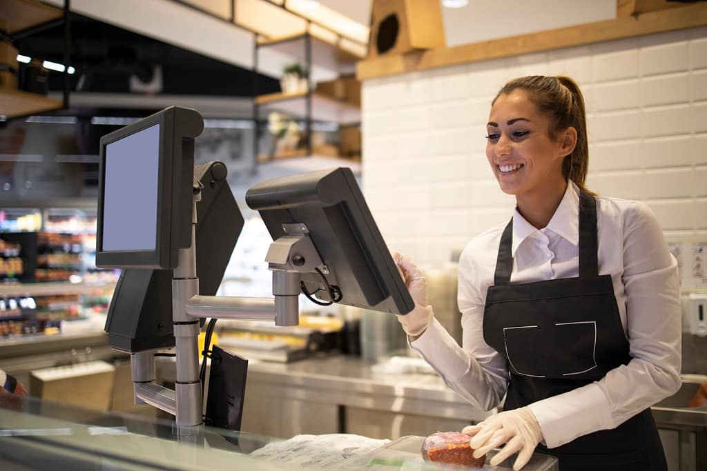 Restaurant Management Software 12 supermarket worker measuring selling meat customer scaled
